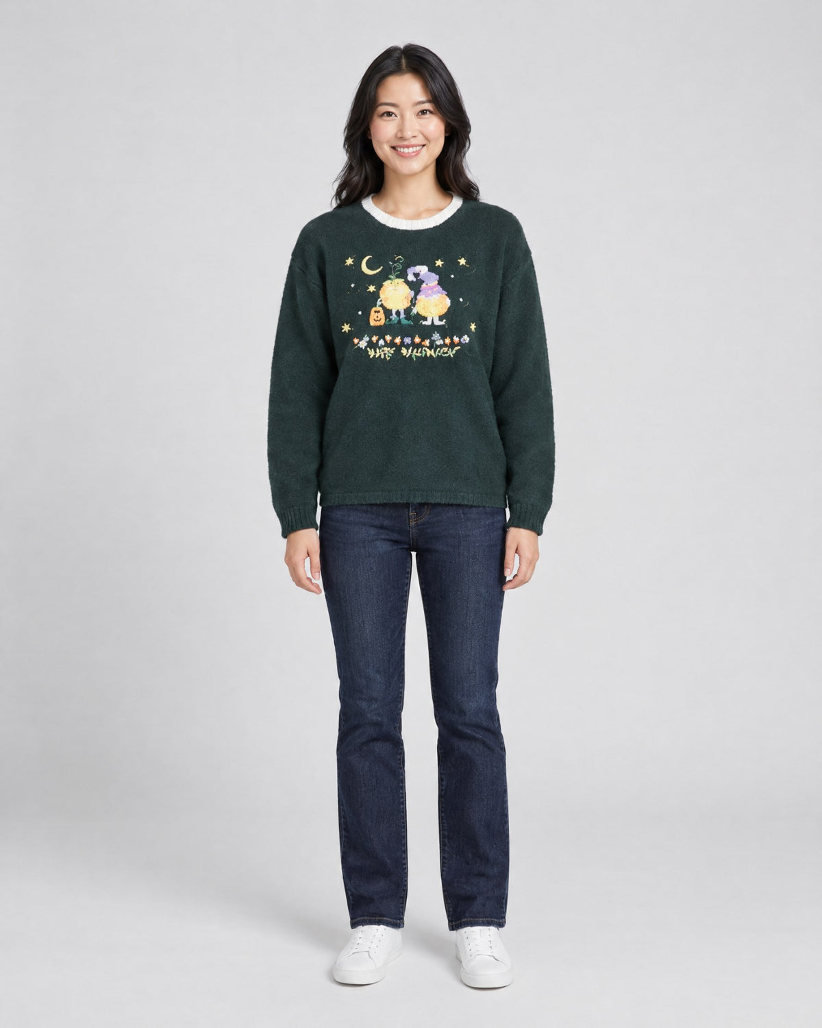 Model wearing a vintage trick-or-treat pumpkin ugly sweater