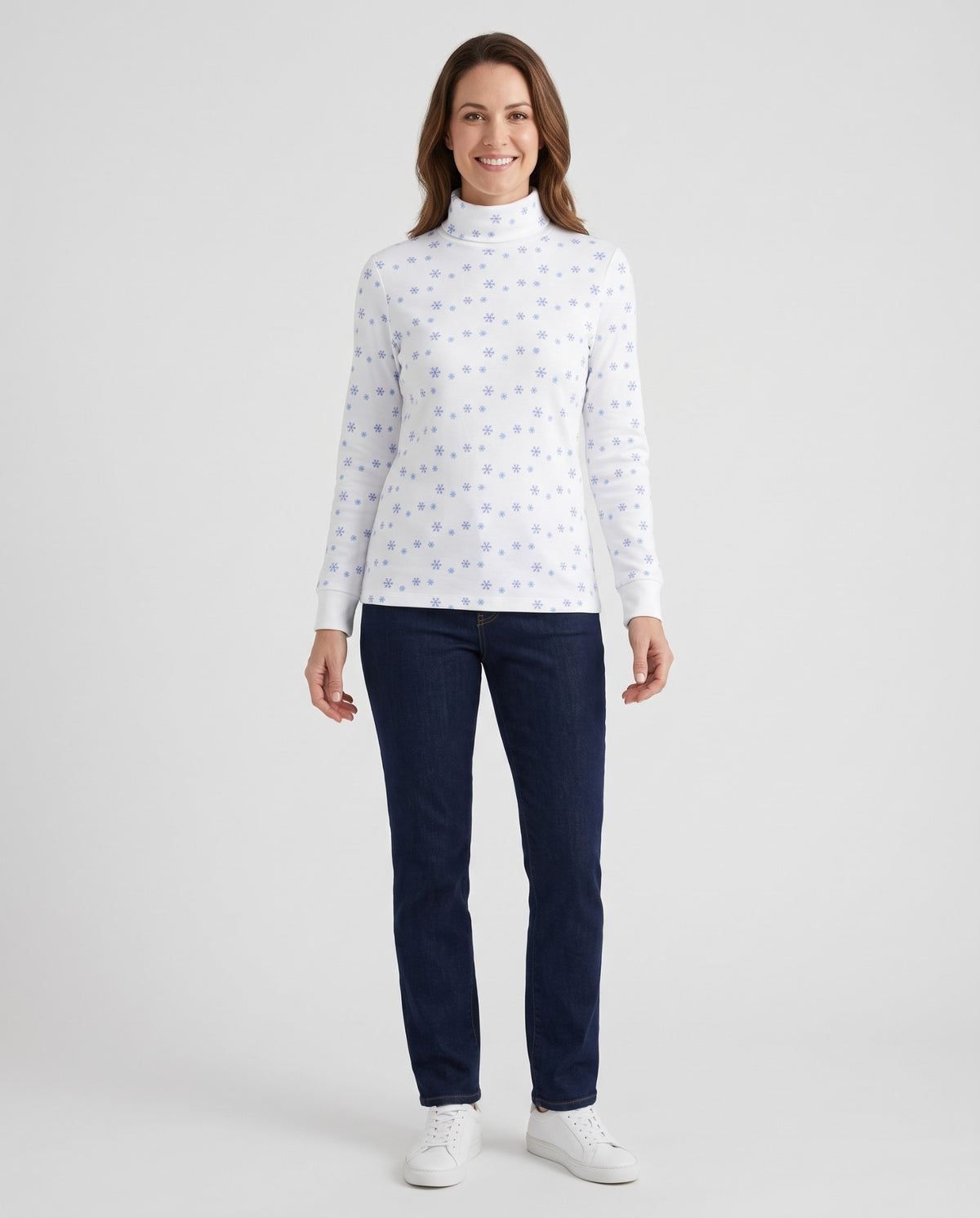 Model showing the fit of a vintage blue snowflake ugly sweater